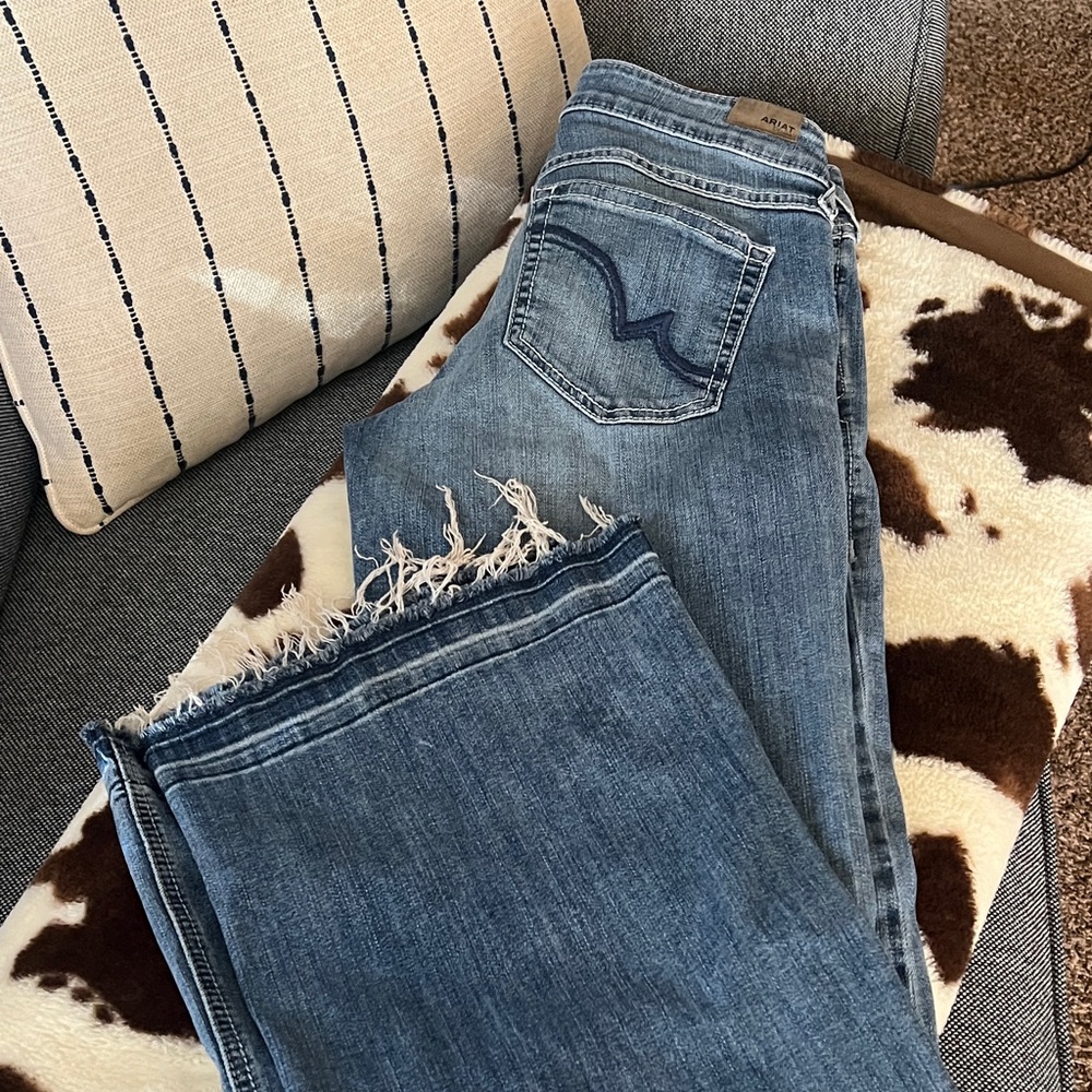 TWO pair Ariat Denim Flare Jeans with Frayed Hem. One size 28R the other 27R